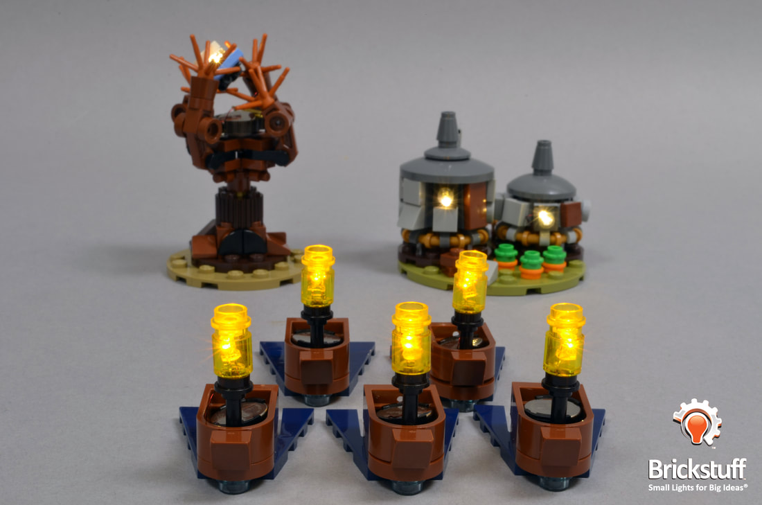 Photo of LEGO Hogwarts Castle boats, whomping willow, and Hagrid's Hut with the Brickstuff light and sound kit installed.