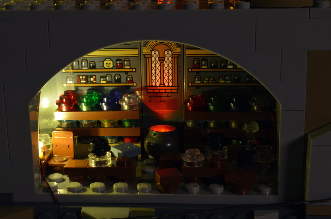 Photo of LEGO Hogwarts Castle potion room with the Brickstuff light and sound kit installed.